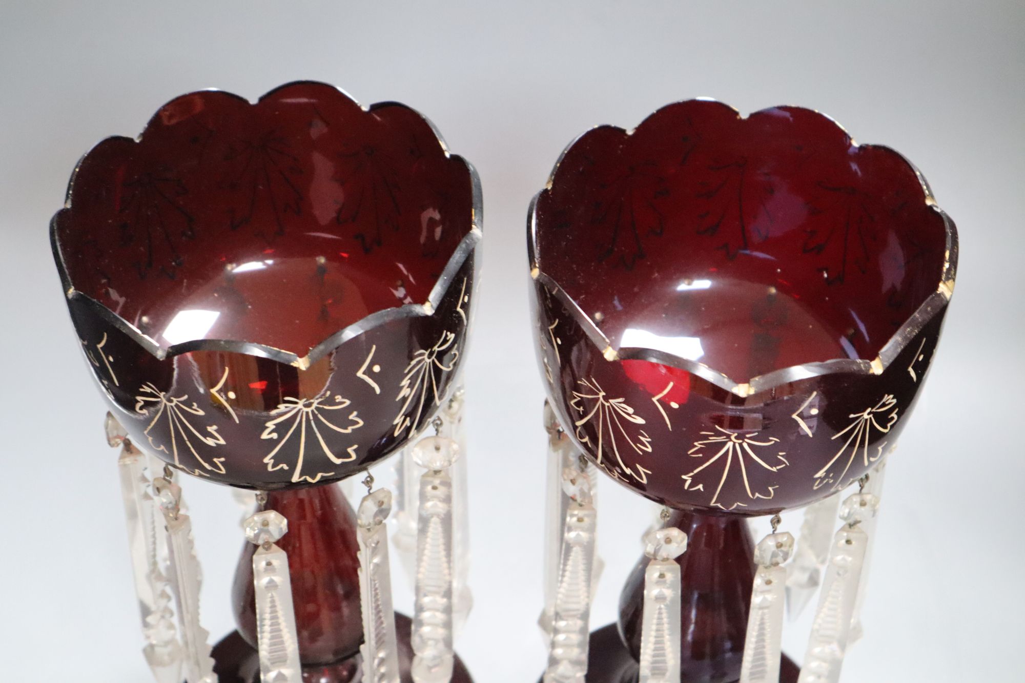 A pair of Victorian ruby glass lustres, height 34cm